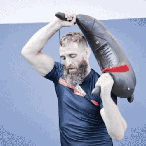 Craig Tetley, ApeStrength coach, demonstrating dynamic Bulgarian Bag swings for functional strength training.