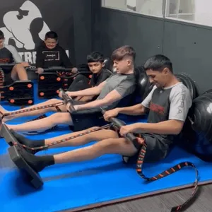 Athlete performing bent-over rows with a barbell for back strength at ApeStrength.